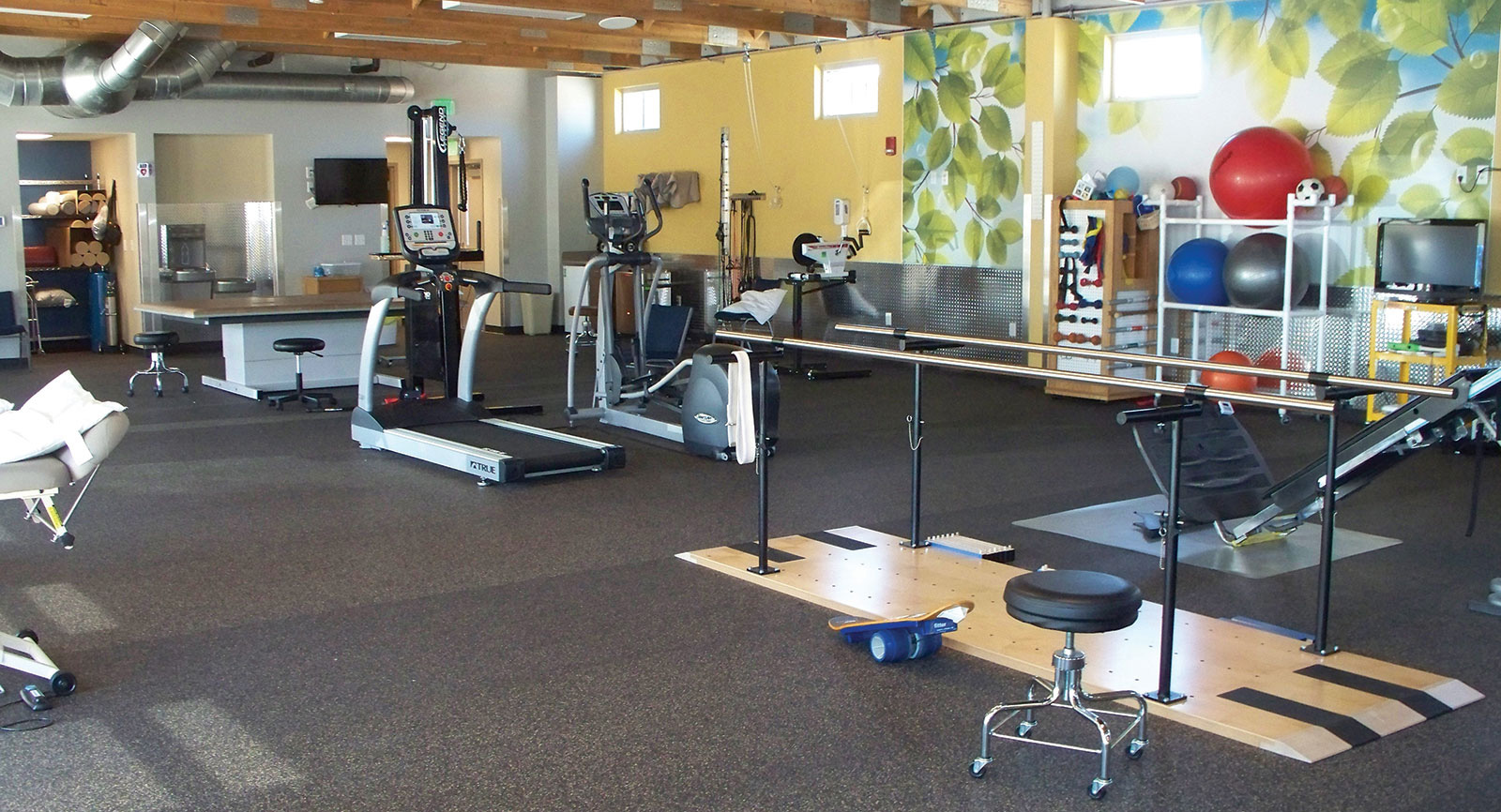 Prowers Medical Center Rehabilitation Center and Gym floor with a variety of equipment for patients to use